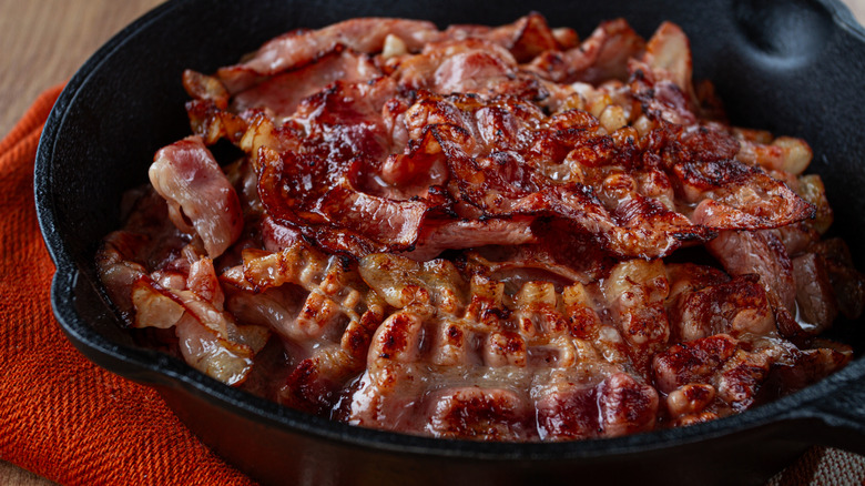 Crispy strips of bacon in a skillet