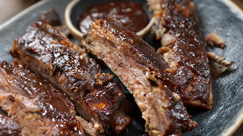 Individual sections of St. Louis style ribs on a plate.