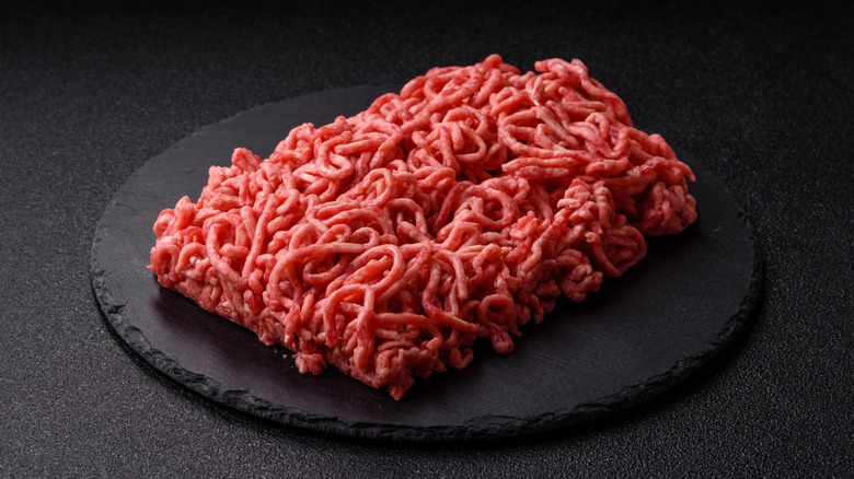 Raw ground beef on a stone plate