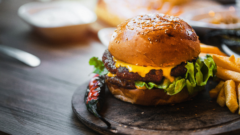 Cheeseburger on wooden plate