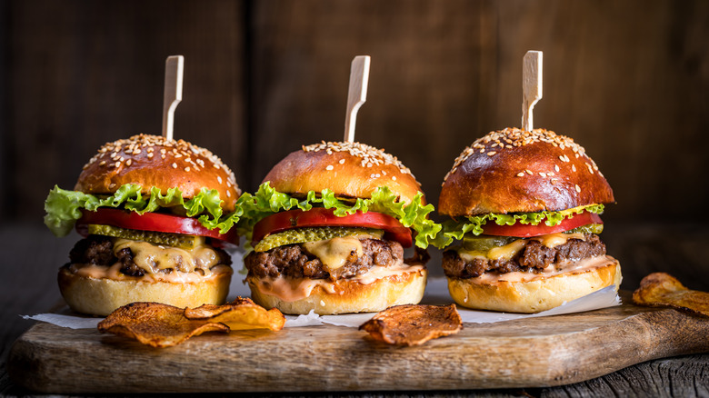 Cheeseburgers on wooden board