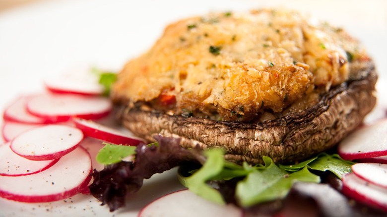 crab and cheese stiffed portobello mushroom with garnish