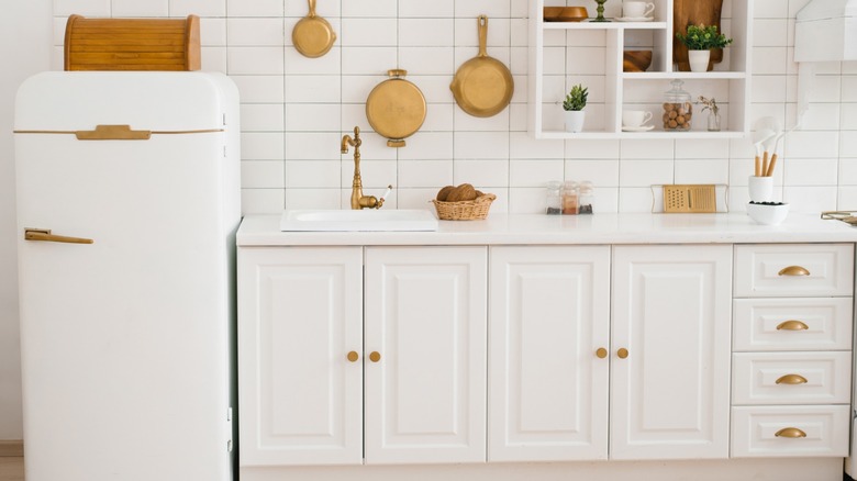 A small apartment kitchen with shelves