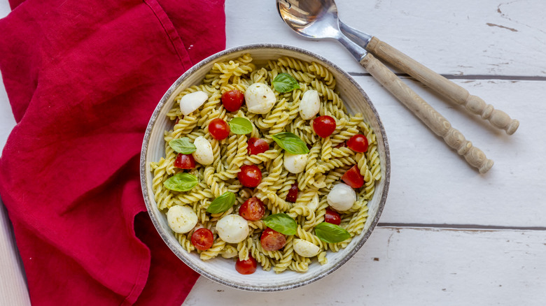 A bowl of pasta salad.