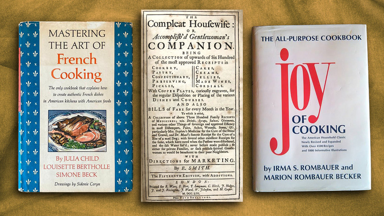 Three vintage cookbooks on a background