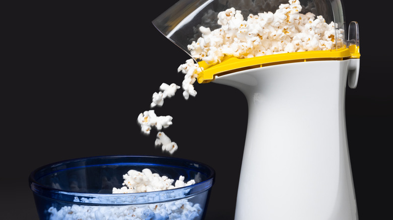 A hot air popper making popcorn.