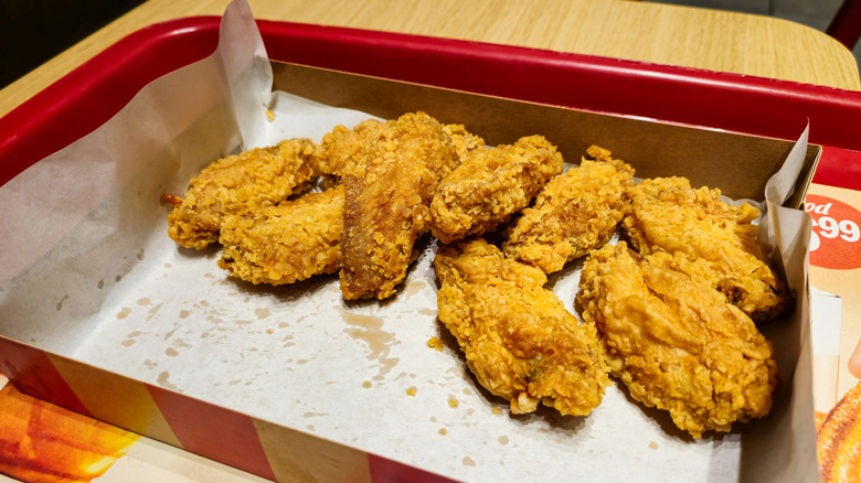 KFC wings sit on a tray.
