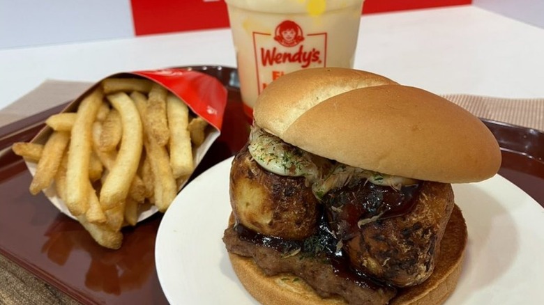 Takoyaki Burger on a tray with Wendy's fries and a drink