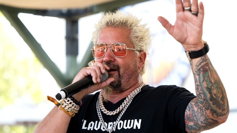 Guy Fieri speaking into microphone