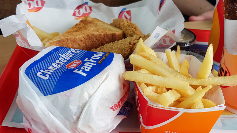 Several menu items from Dairy Queen including a cheeseburger and fries