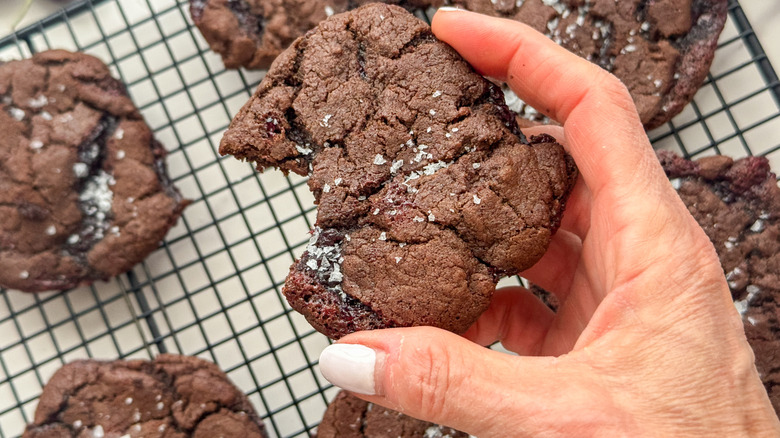 hand holding cookie with salt