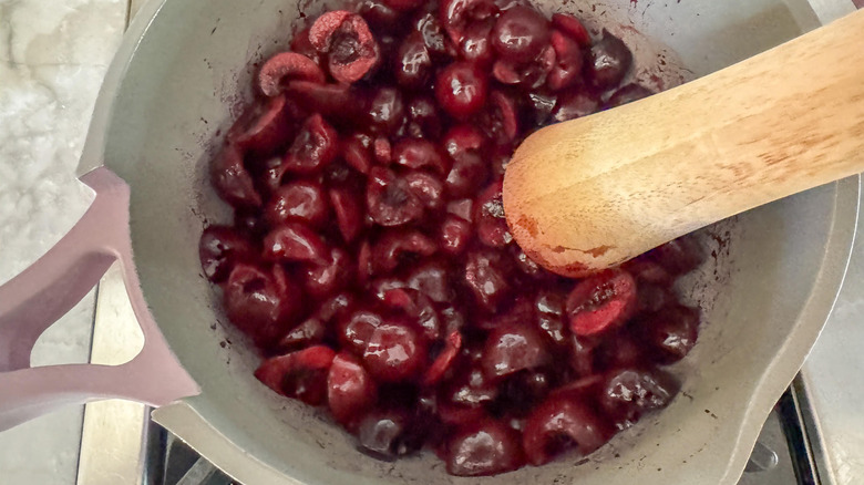 wood mallet mashing cherries