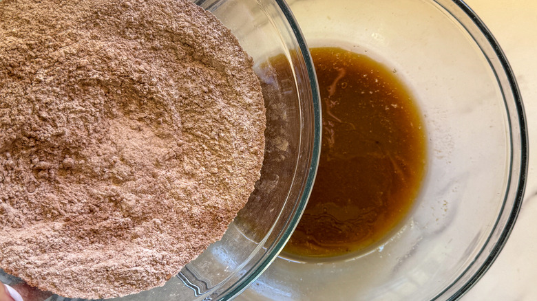 adding dry ingredients to wet