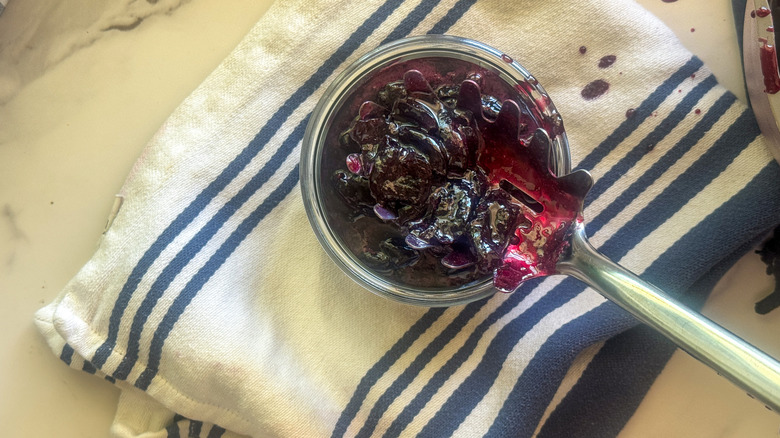 spooning jam into jar