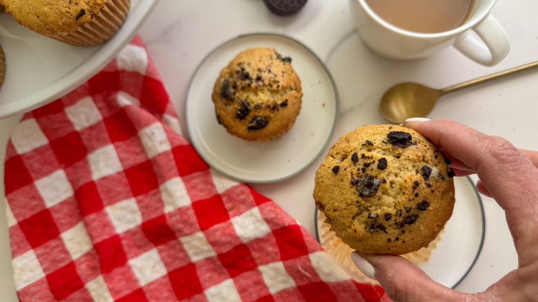 hand holding cookies and cream muffin
