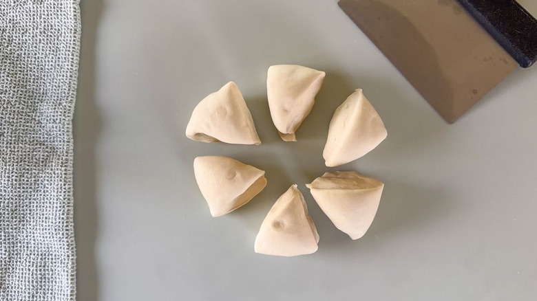 Six wedges of scallion pancake dough