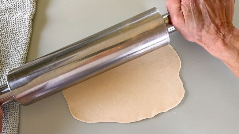 Rolling out scallion pancake dough