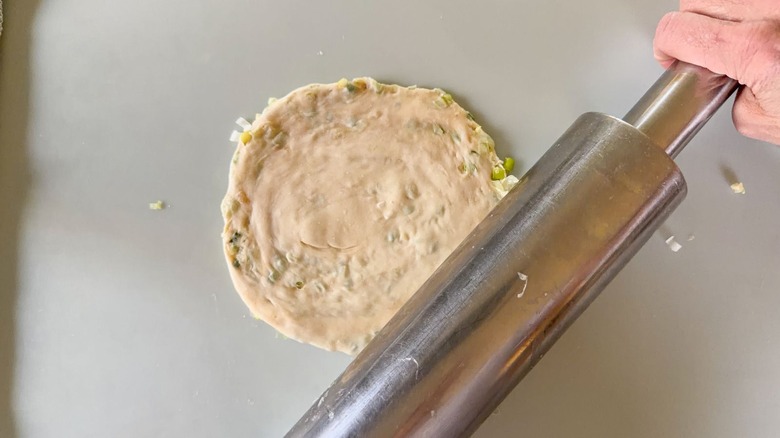 Rolling out scallion pancakes