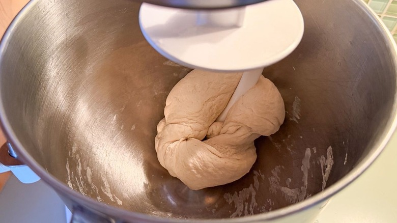 Kneading dough with dough hook in stand mixer bowl