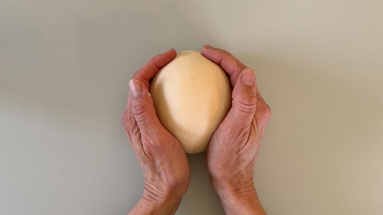 Shaping scallion pancake dough into a ball