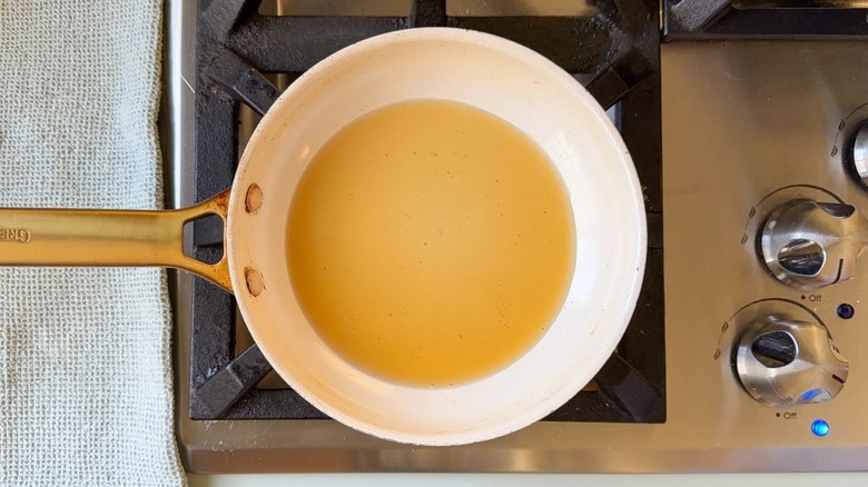 Sesame oil in skillet on stovetop