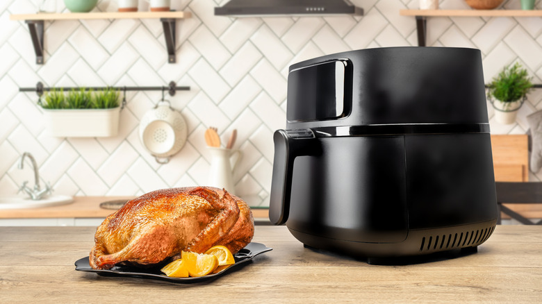Air fryer with a chicken