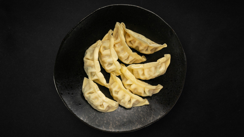 Dumplings on a black plate
