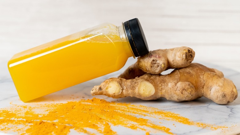 Citrus and ginger wellness juice bottle.