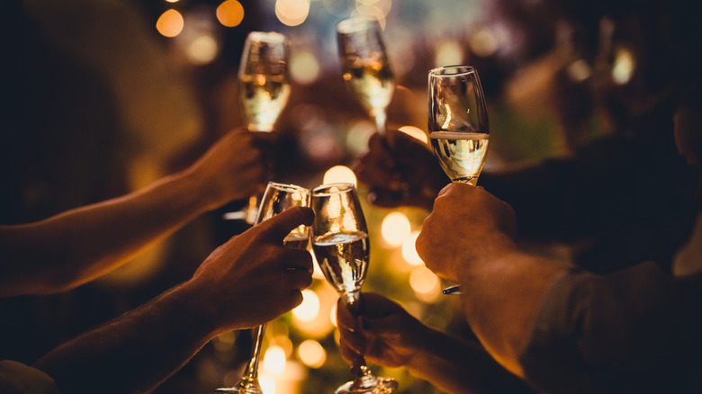 people toasting with champagne flutes