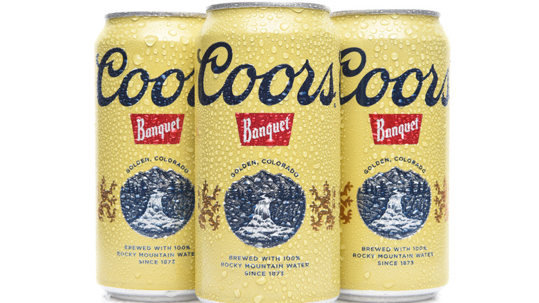 Three cans of Coord Banquet with condensation.