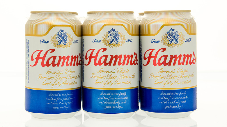 Three cans of Hamm's beer.
