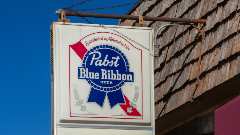 Pabst Blue Ribbon sign on bar exterior.