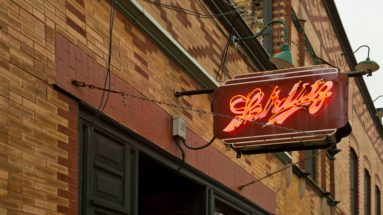 Picture of a Schlitz sign on a building exterior.