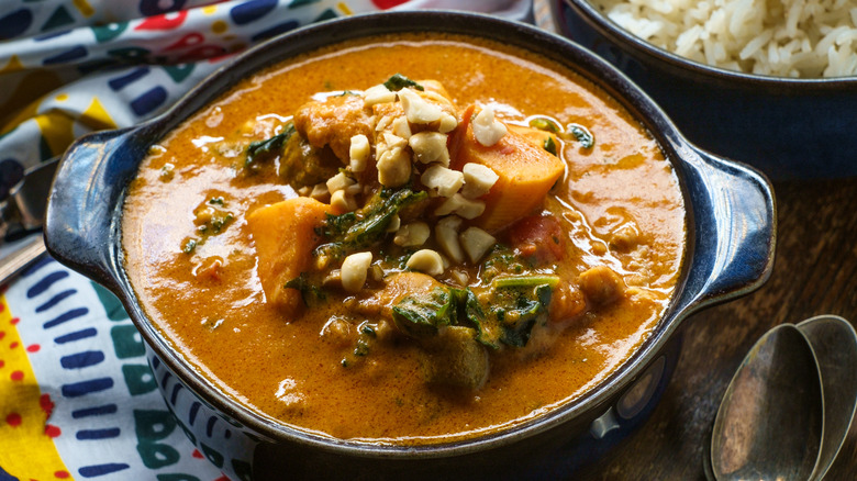 Thick orange soup in blue dish