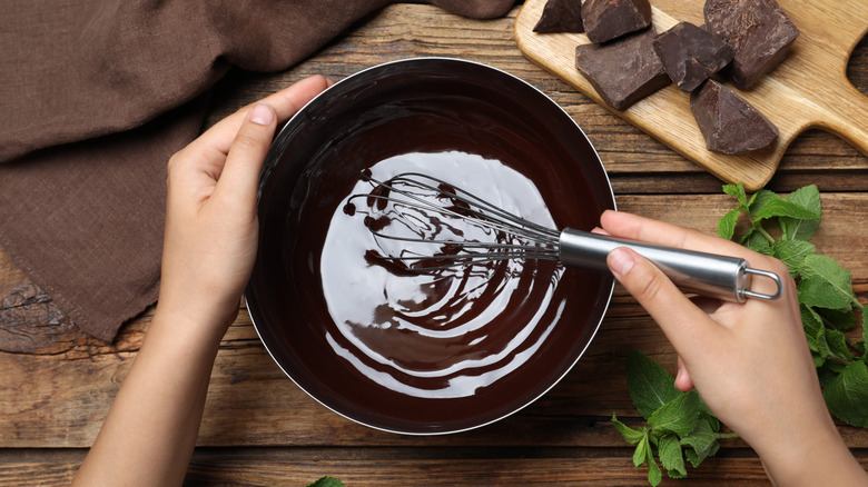 Whisking chocolate to make chocolate mousse