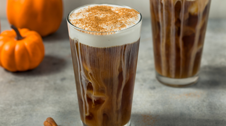 an iced coffee topped with cold foam