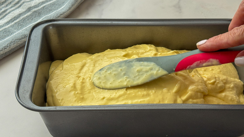 hand smoothing out ice cream