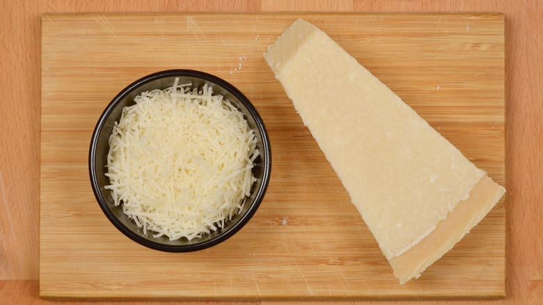 Grated and wedge of parmesan cheese