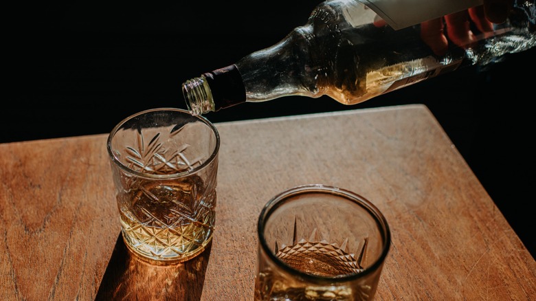 Pouring whiskey into a glass