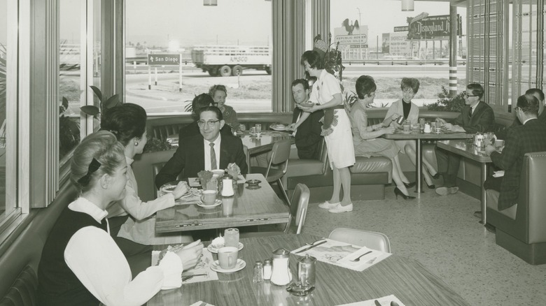 Diners inside of a typical family restaurant in the 1960s.