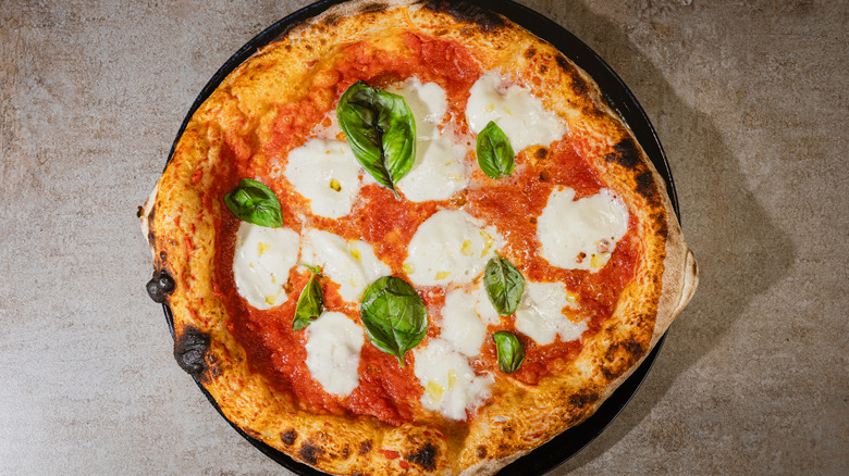 A cooked margherita pizza