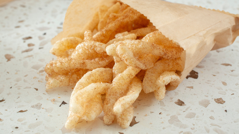 Taco Bell Cinnamon Twists dessert in a white bag
