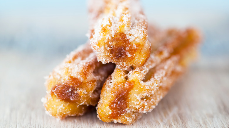 three churros dusted in sugar