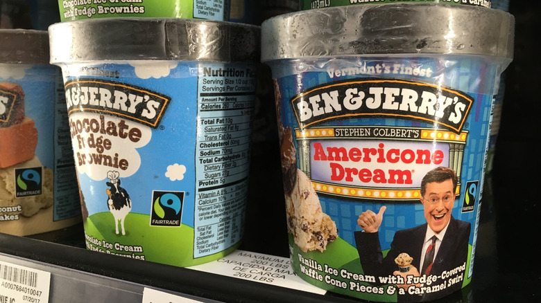 Close-up photo of a pint of Ben & Jerry's Americone Dream ice cream on a store freezer shelf