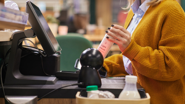 Woman scanning light cream