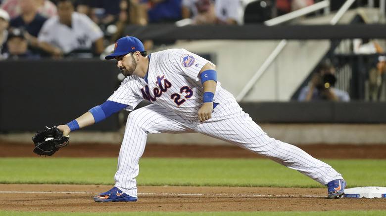 Adrian Gonzalez catches a baseball while playing for the New York Mets