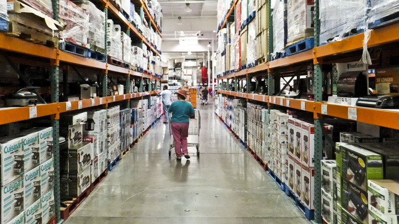 Shopper walking down Costco aisle