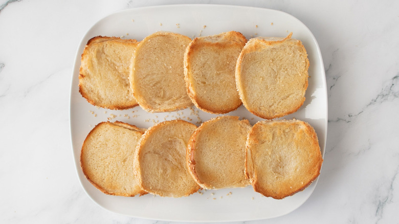Toasted burger buns on plate