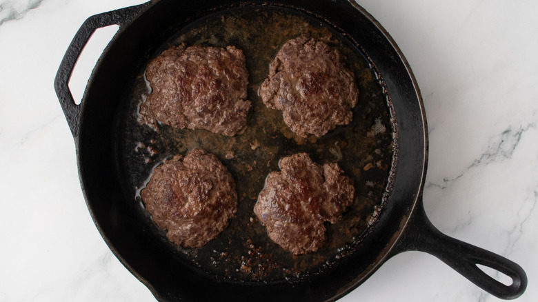 Burgers in cast iron skillet