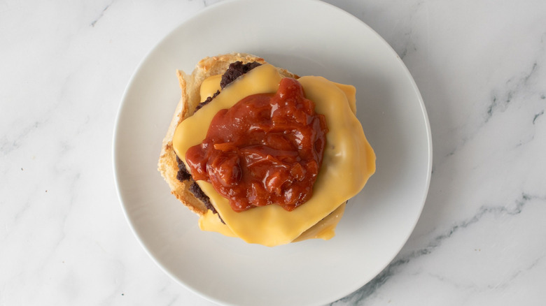 Cheeseburger with barbecue sauce on plate